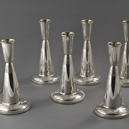 8 silver candlesticks by David Lawrence